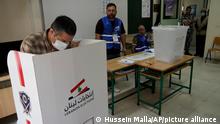 A man casts his ballot during parliamentary elections in Beirut, Lebanon Sunday, May 15, 2022. (AP Photo/Hussein Malla)