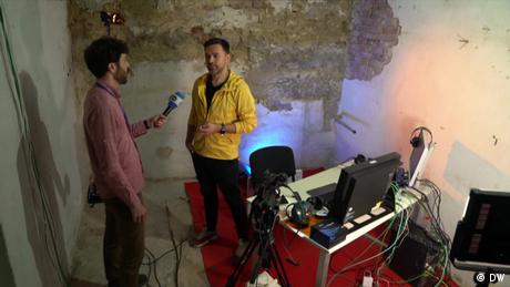 Ukrainian TV presenter Timor Miroshnychenko speaks to DW's Amien Essif in an underground studio.