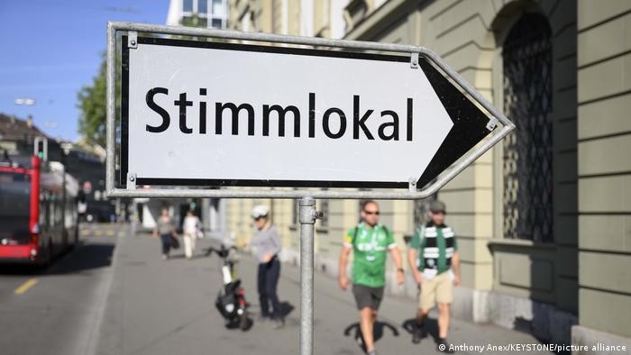 A sign pointing to a polling station in Bern, Switzerland