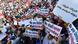 Protesters holding up signs at a demonstration in central Tunis Protesters holding up signs at a demonstration in central Tunis