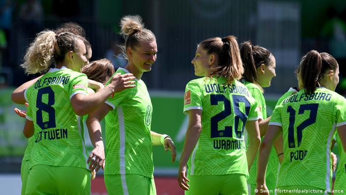 Wolfsburg players celebrate after a goal