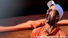 TOPSHOT - Serbia's Novak Djokovic celebrates winning a game during the final match of the Men's ATP Rome Open tennis tournament against Greece's Stefanos Tsitsipas on May 15, 2022 at Foro Italico in Rome. (Photo by Tiziana FABI / AFP) (Photo by TIZIANA FABI/AFP via Getty Images)