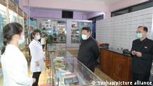 N.K. leader holds politburo meeting amid COVID-19 outbreak North Korean leader Kim Jong-un (C), wearing a face mask amid the COVID-19 outbreak, inspects a pharmacy in Pyongyang, in this undated photo released by the North's official Korean Central News Agency. Kim held an emergency consultative meeting of the political bureau of the Workers' Party at the headquarters of the party's Central Committee in Pyongyang on May 15, 2022. In the meeting, Kim rebuked officials for failing to deliver medicine to its people in time and ordered the mobilization of soldiers to stabilize the supply of medicine in the capital. (For Use Only in the Republic of Korea. No Redistribution) (Yonhap)/2022-05-16 07:54:30/