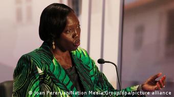 Martha Karua speaks into a microphone