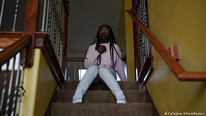 Justise McGowan, sitting on a staircase in Matteson, Illinois.