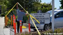 16.05.2022
A church staff member raises police tape for a car to exit at the Geneva Presbyterian Church May 16, 2022 after one person was killed and five injured during a shooting May 15, 2022 at the church in Laguna Woods, California. - A Chinese immigrant who padlocked a church and opened fire on its Taiwanese-American congregation, killing one person and injuring five others, was motivated by hatred of the island and its people, US investigators said May 16. (Photo by Robyn Beck / AFP)