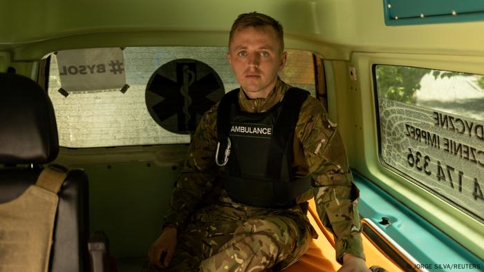 Ukrainian medic Bohdan Marchuk from the Volunteer Mobile Hospital Pirogov waits in his ambulance 