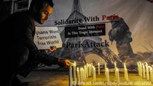 epa05027269 An Afghan civil society activist lights candles to pray for the victims of the 13 November Paris attacks in Kabul, Afghanistan, 15 November 2015. At least 132 people were killed and some 350 injured in the terror attacks which targeted the Bataclan concert hall, the Stade de France national sports stadium, and several restaurants and bars in the French capital. Authorities believe that three coordinated teams of terrorists armed with rifles and explosive vests carried out the attacks, which the Islamic State (IS) extremist group has claimed responsibility for. EPA/JAWAD JALALI ++