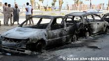 Vehicles destroyed after fighting between soldiers loyal to the head of Libya's Government of National Unity, Abdulhamid al-Dbeibah, and rival forces, are seen in Tripoli, Libya, May 17, 2022. REUTERS/Hazem Ahmed