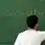 A man writes the word "integration" on a chalkboard