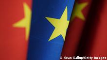 BERLIN, GERMANY - JANUARY 26: Flags of China and the European Union stand at the Chancellery on January 26, 2021 in Berlin, Germany. The two entities recently reached a comprehensive agreement on investment. (Photo by Sean Gallup/Getty Images)