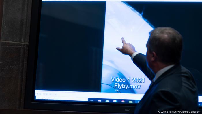 Deputy Director of Naval Intelligence Scott Bray points to a video display of a UAP during a hearing of the US House Intelligence, Counterterrorism, Counterintelligence, and Counterproliferation Subcommittee hearing on Unidentified Aerial Phenomena