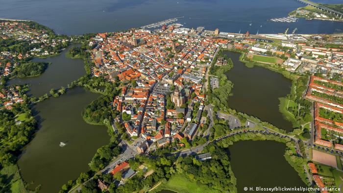 The center of the town of Stralsund on water as seen from above.