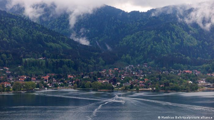 A village on the Tegernsee with the mountains in mist.
