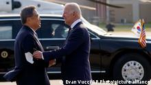 South Korean Foreign Minister Park Jin greets U.S.President Joe Biden as he arrives at Osan Air Base, Friday, May 20, 2022, in Pyeongtaek, South Korea. (AP Photo/Evan Vucci)
