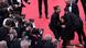 woman taken away on red carpet by men in suits woman taken away on red carpet by men in suits