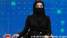 22.05.2022
TOPSHOT - A female presenter for Tolo News, Thamina Usmani, covers her face in a live broadcast at Tolo TV station in Kabul on May 22, 2022. - Women presenters on Afghanistan's leading news channels went on air May 22 with their faces covered, a day after defying a Taliban order to conceal their appearance on television. (Photo by Wakil KOHSAR / AFP) (Photo by WAKIL KOHSAR/AFP via Getty Images)