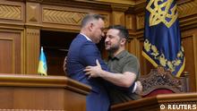 Polish President Andrzej Duda embraces Ukraine's President Volodymyr Zelenskiy during a session of Ukrainian parliament, as Russia's attack on Ukraine continues, in Kyiv, Ukraine May 22, 2022. REUTERS/Stringer