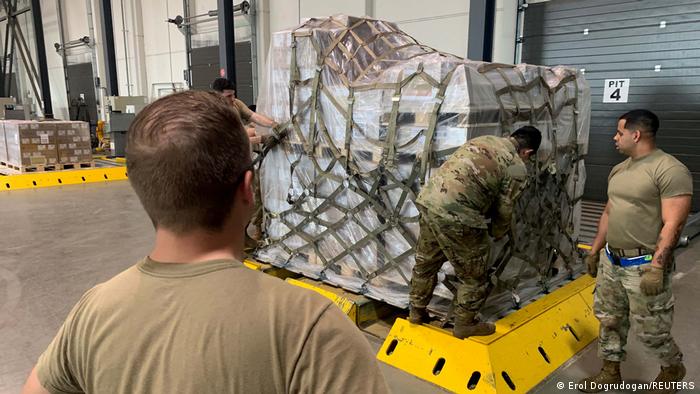 American soldiers loading baby formula for air transport to the US