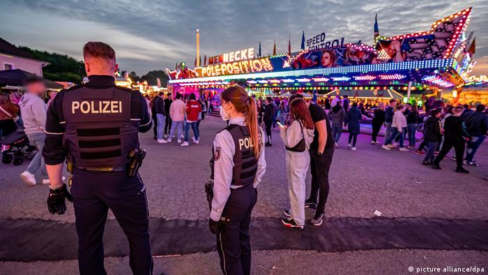 Police officers at a funfair in Lüdenscheid, western Germany, after a fatal shooting on May 21, 2022.