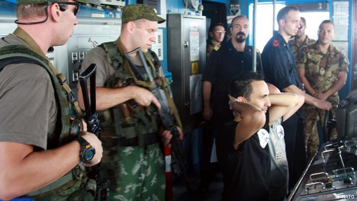 Russian sailors rehearse anti-piracy tactics with the crew of the Italian ship San Marco