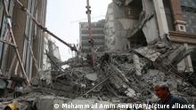 In this photo provided by Fars News Agency, rubble remains from a 10-story commercial building under construction that collapsed killing several people in the southwestern city of Abadan, Iran, Monday, May 23, 2022. There are fears the casualty toll could be much higher as more than 80 people were still believed to be trapped under the rubble after the Metropol building toppled, burying shops and even some cars in the surrounding streets, state TV reported. (Mohammad Amin Ansari, Fars News Agency via AP)
