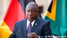 South African President Cyril Ramaphosa conducts a press conference during the visit of German Chancellor Olaf Scholz (not pictured) at the Union Buildings in Pretoria on May 24, 2022. (Photo by Phill Magakoe / AFP)