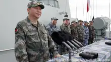 FILE - In this April 12, 2018, file photo released by Xinhua News Agency, Chinese President Xi Jinping speaks after reviewing the Chinese People's Liberation Army (PLA) Navy fleet in the South China Sea. A new Pentagon report lays out U.S. concerns about China's growing military might, underscoring worries about a possible attack against Taiwan. The report's release on Jan. 15, 2019 came just a week after Chinese President Xi Jinping called on his People's Liberation Army to better prepare for combat. (Li Gang/Xinhua via AP, File)