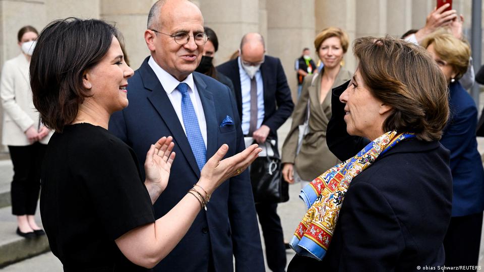 Polish Foreign Minister Zbigniew Rau speaks with German Foreign Minister Annalena Baerbock and French Foreign Minister Catherine Colonna.