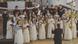 Group photo of the Kamerkoris DeCoro, women in long white dresses. Group photo of the Kamerkoris DeCoro, women in long white dresses.