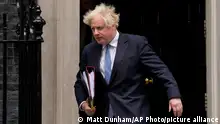 British Prime Minister Boris Johnson leaves 10 Downing Street to attend the weekly Prime Minister's Questions at the Houses of Parliament, in London, Wednesday, May 25, 2022. A report into lockdown-breaching U.K. government parties says blame for a culture of rule-breaking in Prime Minister Boris Johnson's office must rest with those at the top. Senior civil servant Sue Gray's long-awaited report was published Wednesday. (AP Photo/Matt Dunham)