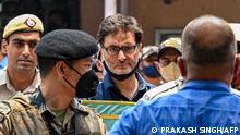 Police and security personnel escort pro-independence party Jammu Kashmir Liberation Front chairman Yasin Malik (C) to a holding area after a sentencing hearing at Patiala house court in New Delhi on May 25, 2022. - (Photo by Prakash SINGH / AFP)