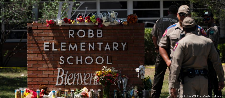 Flowers and candles are placed outside Robb Elementary School in Uvalde, Texas, to honor the victims killed in Tuesday's shooting at the school.