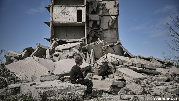 A boy on the ruins of a residential building in Kramatorsk