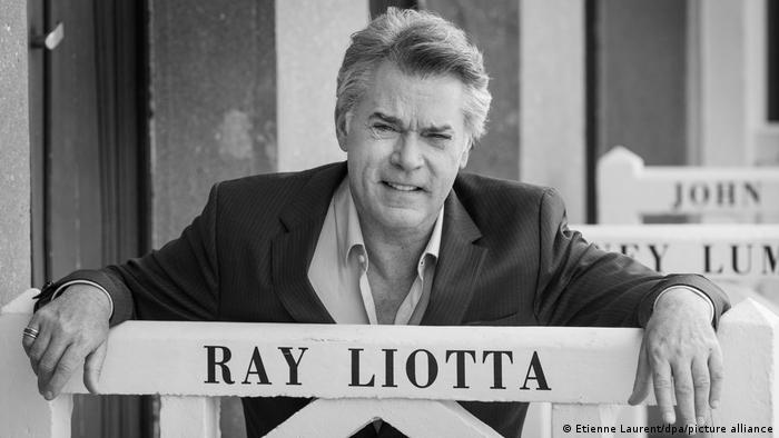 Ray Liotta poses for the photographers after he unveiled his cabin sign as a tribute for his career along the Promenade des Planches during the 40th annual Deauville American Film Festival