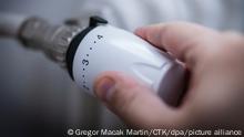 Hand with thermostat regulator on central heating system, in Prague, Czech Republic, November 7, 2021. (CTK Photo/Martin Macak Gregor)