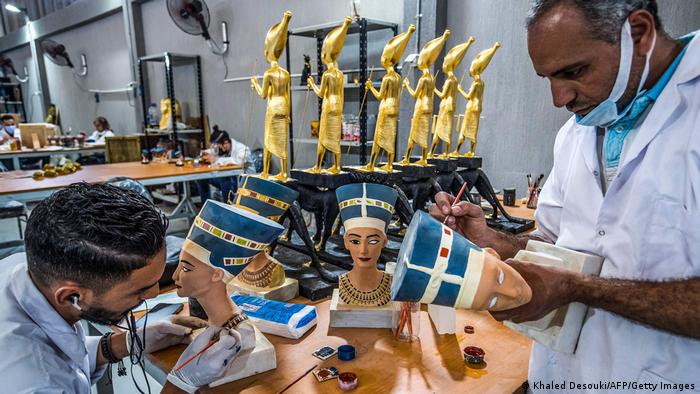 Technicians paint replicas of Ancient Egyptian busts of Queen Nefertiti being fabricated at the Egyptian government's Konouz (Treasures) factory.