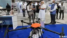 New Delhi: Prime Minister Narendra Modi visits an exhibition at the inauguration of the Bharat Drone Mahotsav at Pragati Maidan, in New Delhi on Friday, May 27, 2022. Union Minister Jyotiraditya Scindia was also seen. (Photo: PIB/IANS)