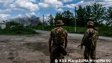 27.05.2022
May 27, 2022, Lysychans k, Ukraine: Soldiers looks at the smoke coming from the oil refinery of Lysychans k. Lysychans k is an elongated city on the high right bank of the Donets River in the Luhansk region. The city is part of a metropolitan area that includes Severodonetsk and Rubizhne the three towns constitute one of Ukraine s largest chemical complexes. The town is now the frontline since the Russian destroyed the bridge connecting Severodonetsk to Lysychans k, Russian troops are attacking the city and moving towards it. The main road that connects Lysychansk to Kramatorsk is occupied by Russian army. Lysychans k Ukraine - ZUMAs197 20220527_zaa_s197_164 Copyright: xRickxMavex 