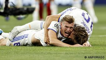 Toni Kroos celebrates with teammate Luka Modric