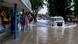 A woman stands on a bus stop bench as a driver of a Volkswagen van navigates a flooded street in Recife, state of Pernambuco, Brazil. (AP Photo/Marlon Costa/Futura Press) A woman stands on a bus stop bench as a driver of a Volkswagen van navigates a flooded street in Recife, state of Pernambuco, Brazil. (AP Photo/Marlon Costa/Futura Press)