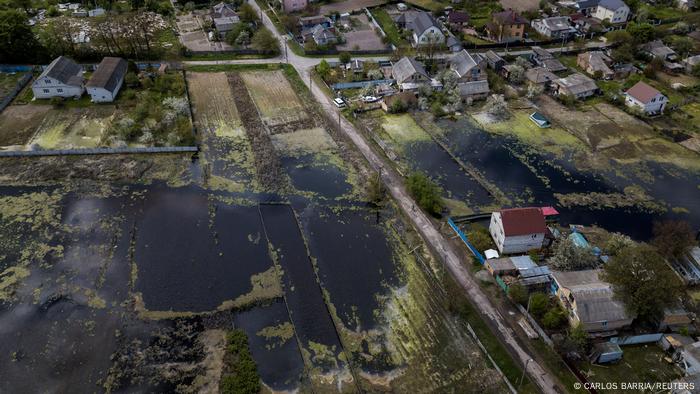 Houses are seen at a flooded area in Demydiv after Ukrainian military forces opened a dam to flood an residential area in order to stop advance of Russian forces