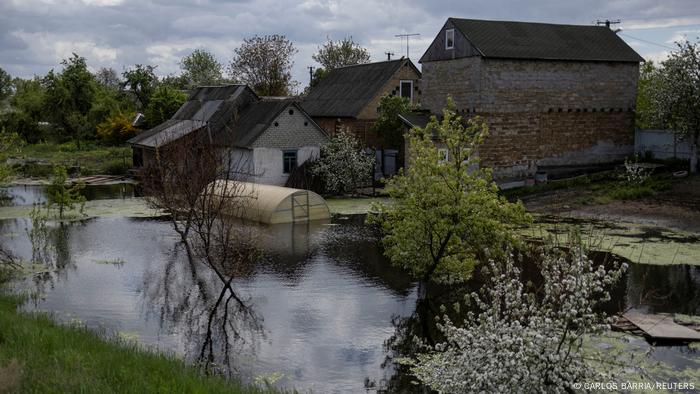 A house in Demydiv is seen flooded at an area after Ukrainian military forces opened a dam to flood an residencial area in order to stop advance of Russian forces