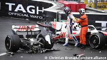 Haas driver Mick Schumacher of Germany leaves his car after crashing during the Monaco Formula One Grand Prix, at the Monaco racetrack, in Monaco, Sunday, May 29, 2022. (Pool Photo/Christian Bruna/Via AP)