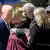 U.S. President Joe Biden embraces Mandy Gutierrez, Principal at Robb Elementary School, where a gunman killed 19 children and two teachers in the deadliest U.S. school shooting in nearly a decade, as first lady Jill Biden and Uvalde Consolidated Independent School District.