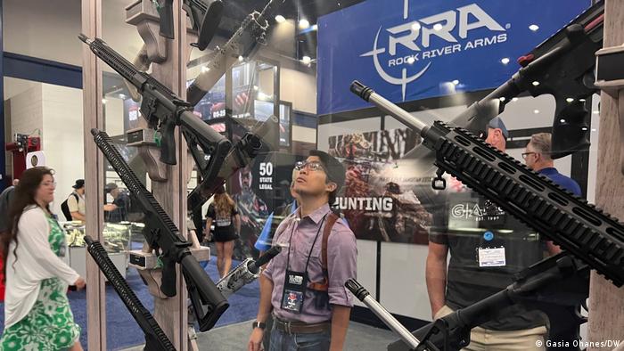 NRA member views guns displayed at convention