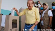 Rodolfo Hernandez, presidential candidate with the Anti-corruption Governors League, casts his ballot during presidential elections in Bucaramanga, Colombia, Sunday, May 29, 2022. (AP Photo/Mauricio Pinzon)
