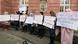 People hold posters during a demonstration outside the courthouse where former Syrian intelligence officer Anwar Raslan stood on trial in Koblenz, western Germany, on January 13, 2022 People hold posters during a demonstration outside the courthouse where former Syrian intelligence officer Anwar Raslan stood on trial in Koblenz, western Germany, on January 13, 2022