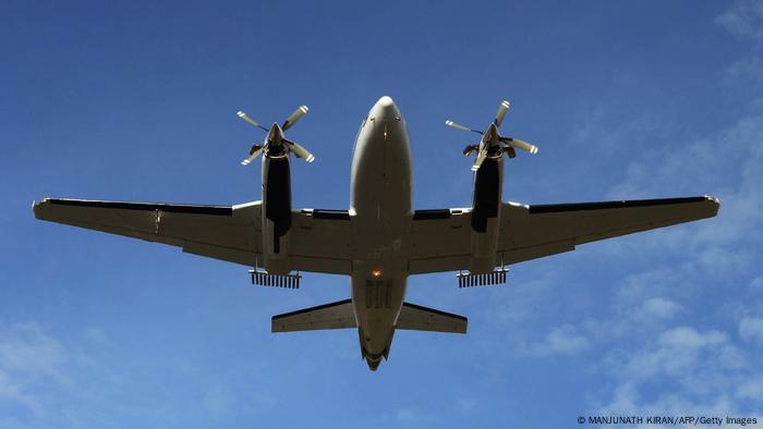 An airplane with silver iodide containers heading out on a cloud seeding mission