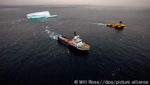 A handout photo made availabke by Greenpeace showing two large tugs towing an iceberg away from the Stena Fourth drilling ship 30 August 2010. This particular berg has been 30 miles away for the past week but after recent stormy weather it is within 5 miles and within Cairn Energy's safety zone of 25km. Cairn Energy's logistics operation around the 'iceberg alley' drill sites. Eight ships are constantly towing and melting icebergs by hosing to prevent any damage to the platforms. The Greenpeace Protest Ship Esperanza is in a stand off with a Danish warship and navy commandos in the freezing seas off Greenland. The Military vessels are protecting an oil rig and drill ship operated by Britain's Cairn Energy. EPA/WILL ROSE/HANDOUT IMAGE AVAILABLE FOR DOWNLOAD BY EXTERNAL MEDIA FOR 14 DAYS AFTER RELEASE. TERMS OF DELIVERY: NO THIRD PARTIES, NO RESALE, NO ARCHIVE, FOR EDITORIAL USE ONLY, NOT FOR MARKETING OR ADVERTISING CAMPAIGNS. CREDIT-LINE COMPULSORY. EDITORIAL USE ONLY/NO SALES ++